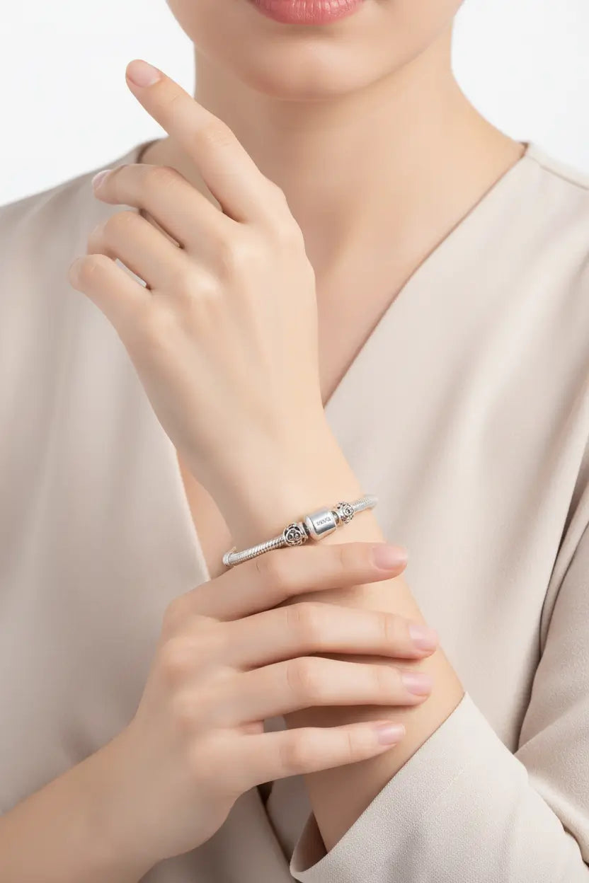 Model wearing a stylish 925 Silver Snake Bone Bracelet, showcasing its elegant design and luxurious shine.
