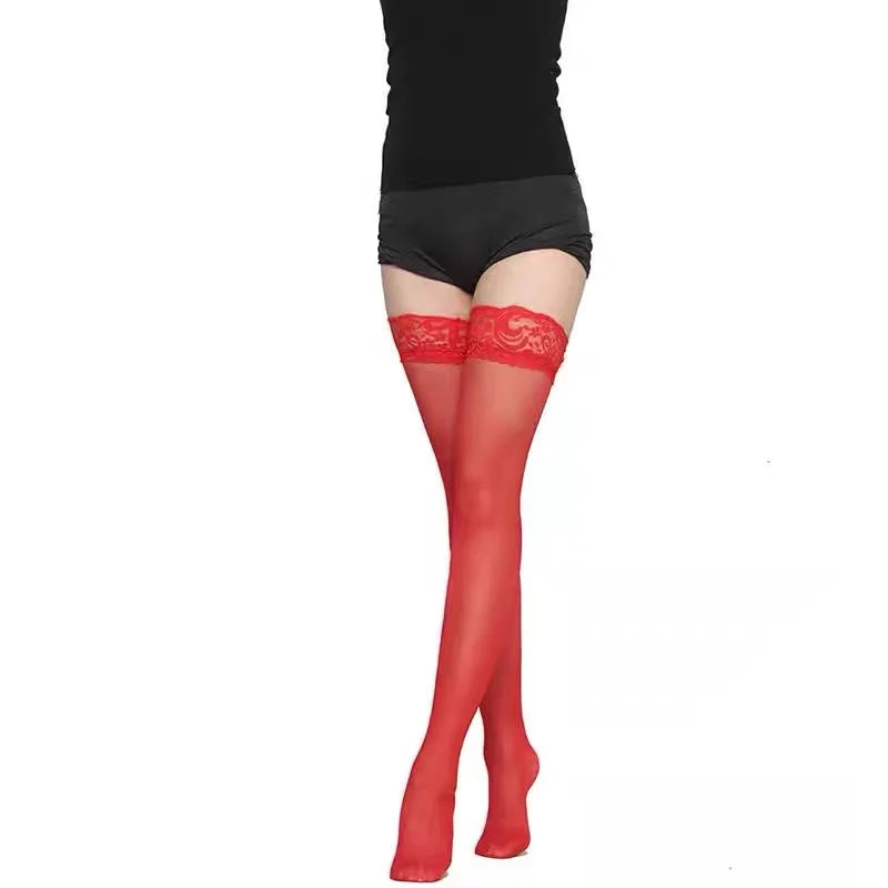 Red lace stockings worn with a black bodysuit on a white background