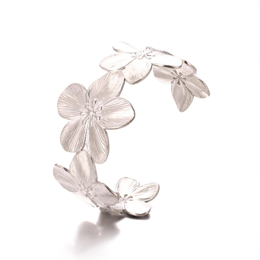 Silver floral earring on a white background