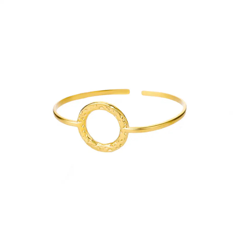Gold bracelet with circular design on a white background