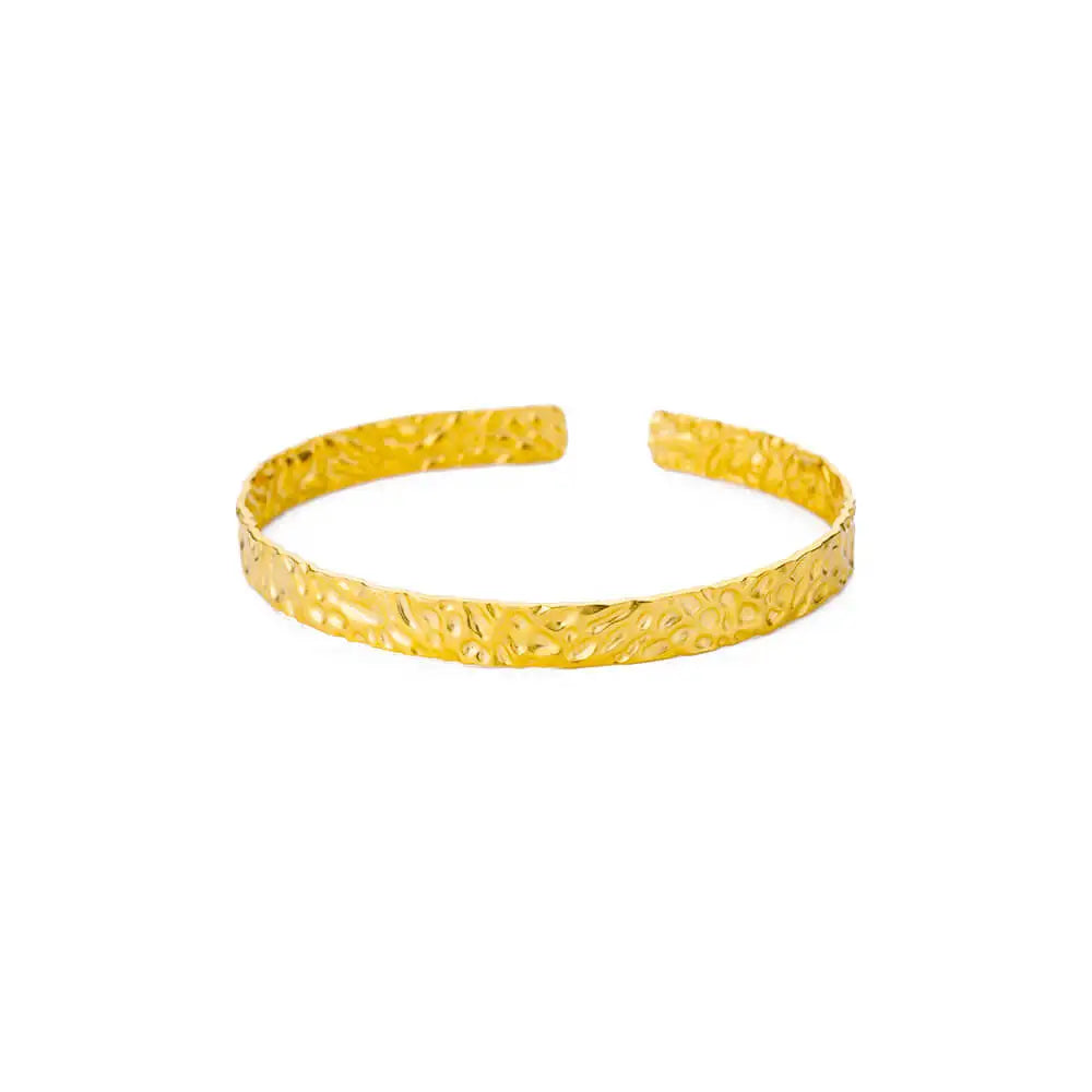 Gold bracelet on a white background