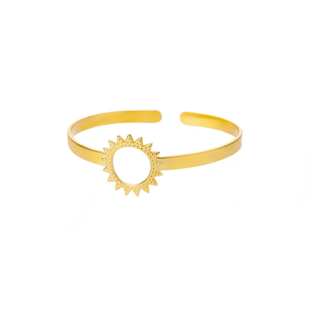 Gold bracelet with sun design on a white background